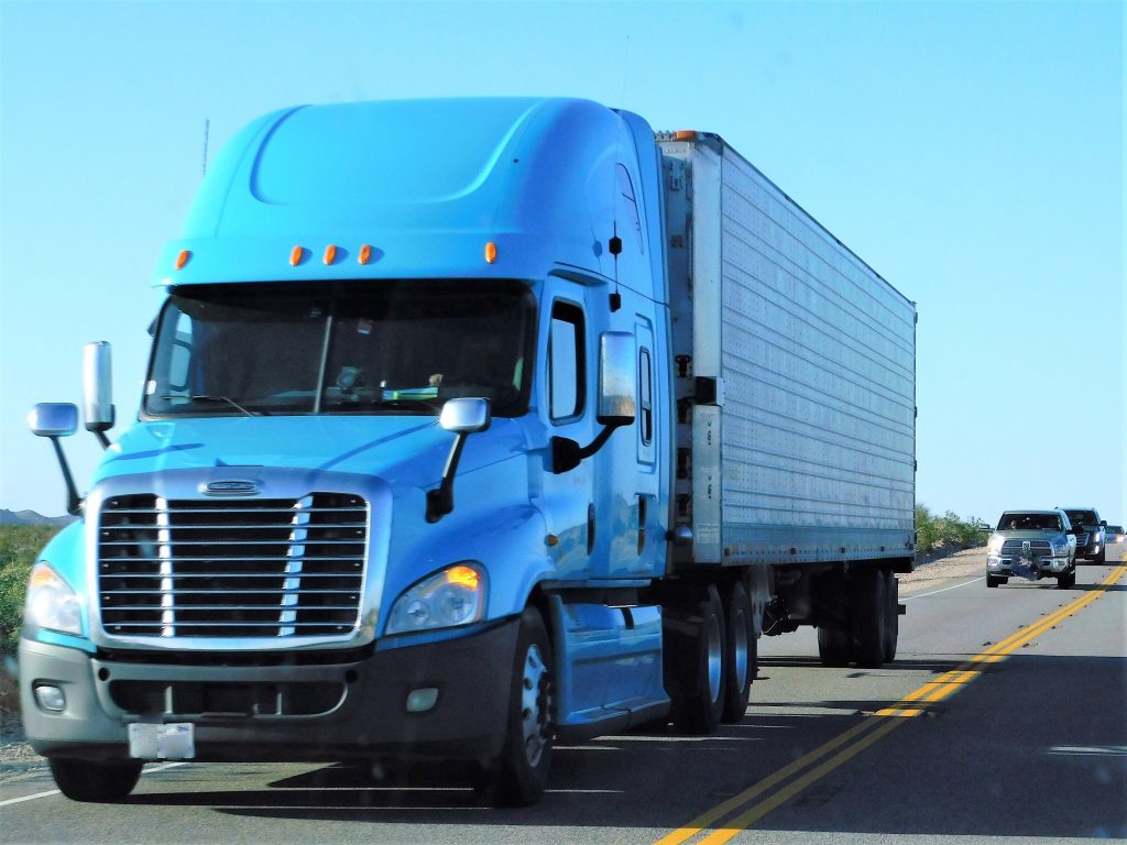 fleet trucks parked, fleet multi color, fleet truck driving on road, trucker safety, G09, G09+, Geotab marketplace partner, jimi iot, construction, fleet trucks, asset tracking, samsara, Geotab, dash cameras, fleet safety, AI, fleet tracking, gps tracking, Geotab marketplace, trailer tracking